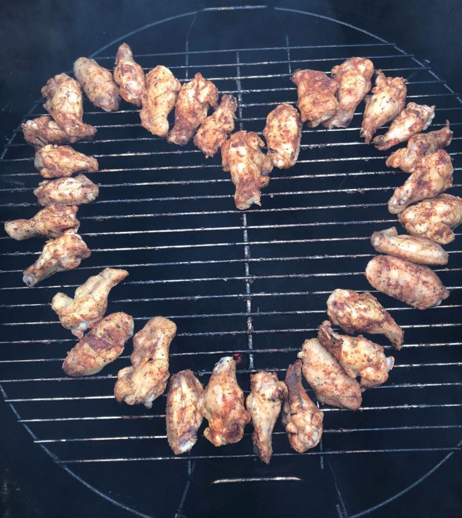 Chicken wings on the grill in a heart shape